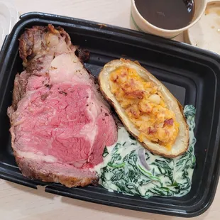 prime rib, au jus, double baked potato, and creamed spinach
