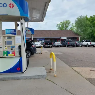 To the right of the gas station