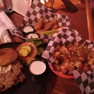 Turkey Smash burger with Loaded tater tots, generously smothered in Queso, bacon bits and diced jalapeños Hot wings 10 out of 10!