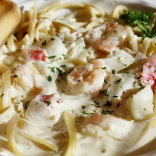 a plate of pasta and shrimp