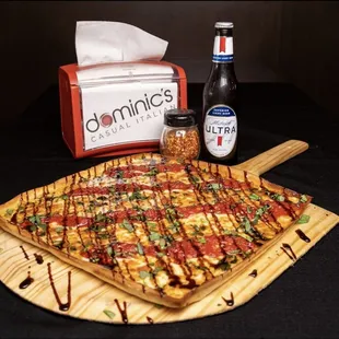 a pizza on a cutting board