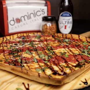 a pizza on a cutting board