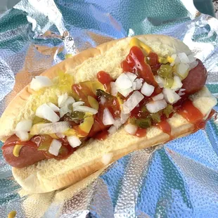 American Hot Dog Martin's Potato Roll, All-Beef Hot Dog, Sweet Relish, Chopped Onions, Ketchup, and Mustard