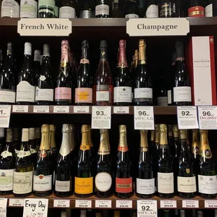 a shelf of wine bottles