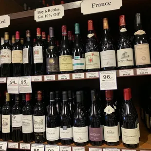 a shelf of wine bottles