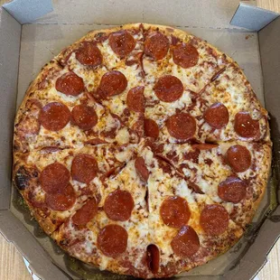 a pepperoni pizza in a box