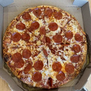 a pepperoni pizza in a box