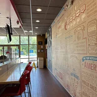 a restaurant with a large wall mural