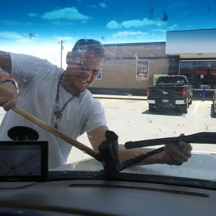 My son cleaning my windshield