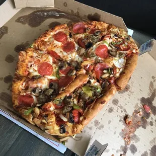 This is how our pizza arrived. It looks so disgusting we won't be eating it and will never order from them again.