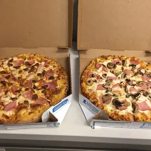 two pizzas in boxes