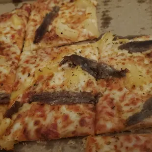 Anchovies and pineapple on thin crust. Don&apos;t knock it till you try it.