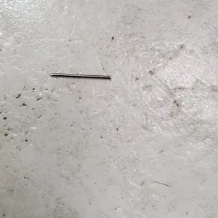 a piece of pizza on the floor