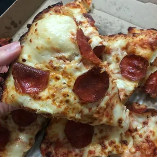 a slice of pepperoni pizza