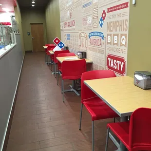 a row of tables and chairs in a restaurant