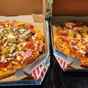 two pizzas in boxes