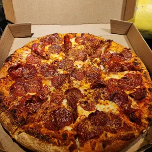 a pepperoni pizza in a box