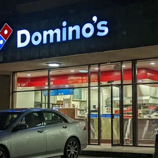 a car parked in front of a restaurant