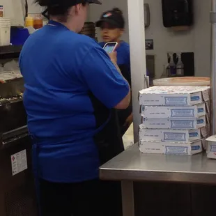 Guess her text messages were more important than helping customers.