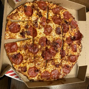 a pepperoni pizza in a box