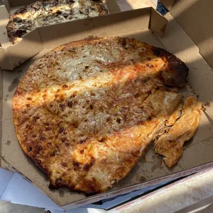 Our cheese pizza today! Almost half pizza. Do they even look at the pizza when they put it in the box?