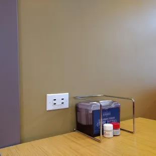 Every both has a charging station to charge your cell phone.