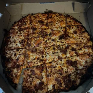 Burnt, poorly cut pizza #1.