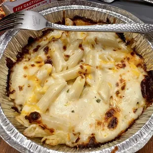 Mac n cheese - fork for size. Thats a very thin layer. I don't know if that's the appropriate amount or not...but it's not a lot.