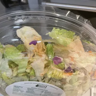 a salad in a plastic container