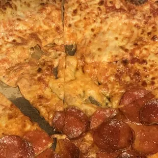 A pizza with two slices that didn't come out right at all, didn't exist when I picked them up