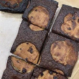 a chocolate chip cookie brownie cut into squares