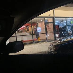 a car parked in front of a restaurant
