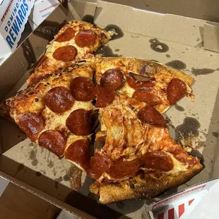 Poorly placed pizza, looks like it was just thrown in the box.