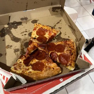 a slice of pepperoni pizza