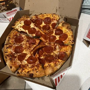 a pepperoni pizza in a box