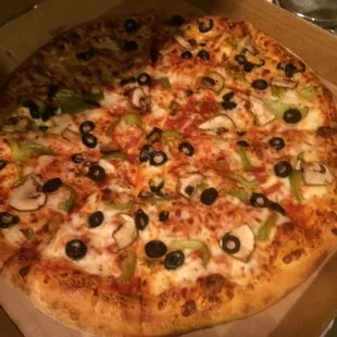Large pizza with 3 toppings: olives, mushrooms, and green bell pepper