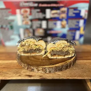 a sandwich on a wooden board