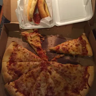 Soggy, bland pizza and breadsticks, that arrived cold after nearly an hour, even though I live just minutes away.