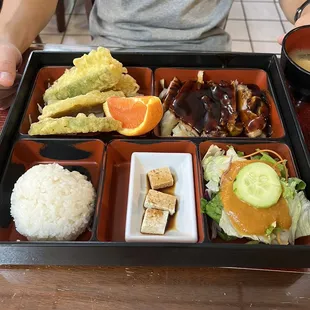 Combination plate with teriyaki chicken, rice, tofu, salad and fresh tempura