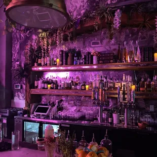 a bar with purple lighting