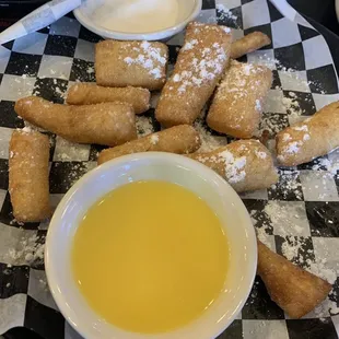 a plate of food with dipping sauce