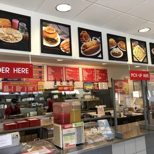 a restaurant counter and menus