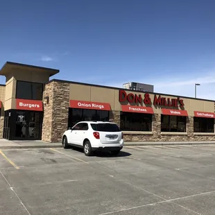 a car parked in front of the store