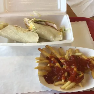 #11 Smoked Turkey wrap with cheese fries.