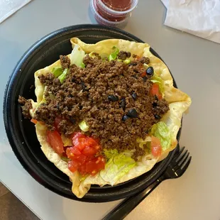 a plate of taco and a fork