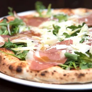 Pizza Kesté: tomato sauce, imported buffalo mozzarella, arugula, prosciutto di Parma, shaved pecorino