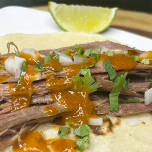 Barbacoa(lamb) taco on handmade tortilla