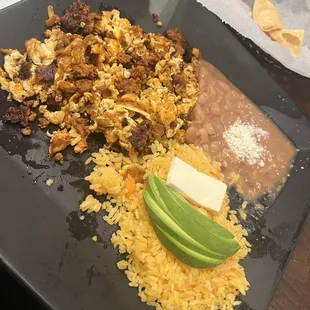 Scrambled eggs w/ chorizo, rice, beans, &amp; Avacado