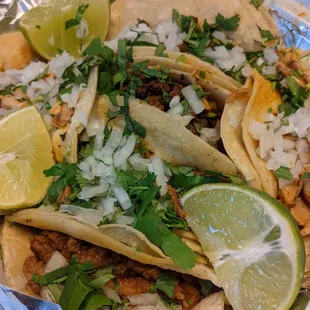 Tacos al pastor, carne asada, pollo, y chorizo con carne asada. Highly recommend al pastor.