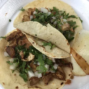 Two carnitas tacos and a bottled water for $5.